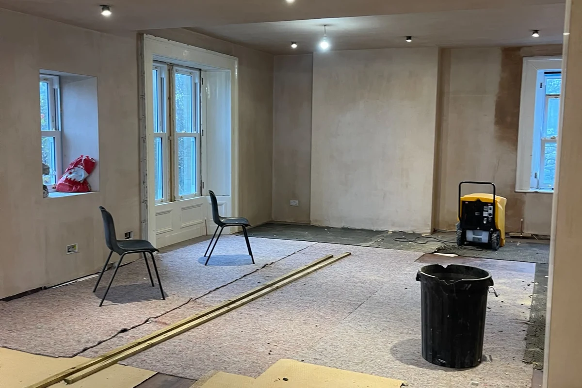 Dehumidifier in use during the drying phase after basement waterproofing work in Newcastle