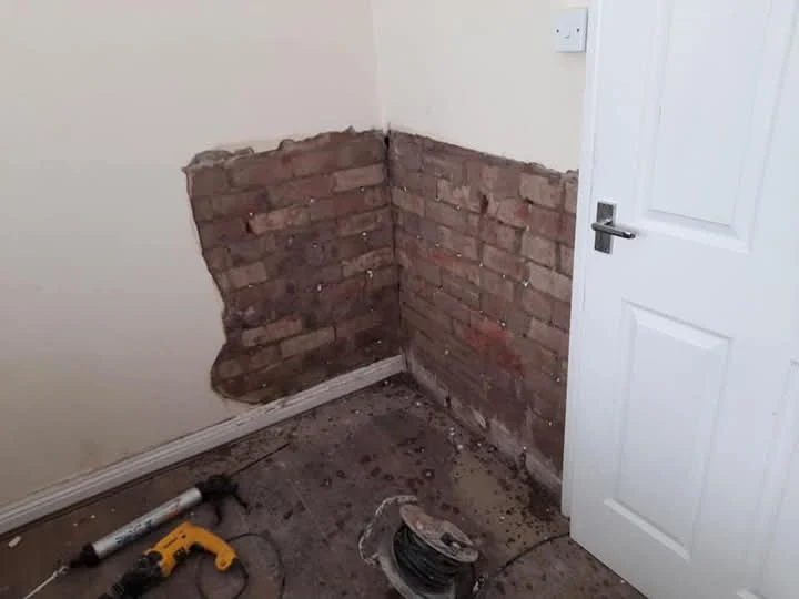 Damp proof course injection on a Newcastle wall by Newcastle Barrier Damp Proofing