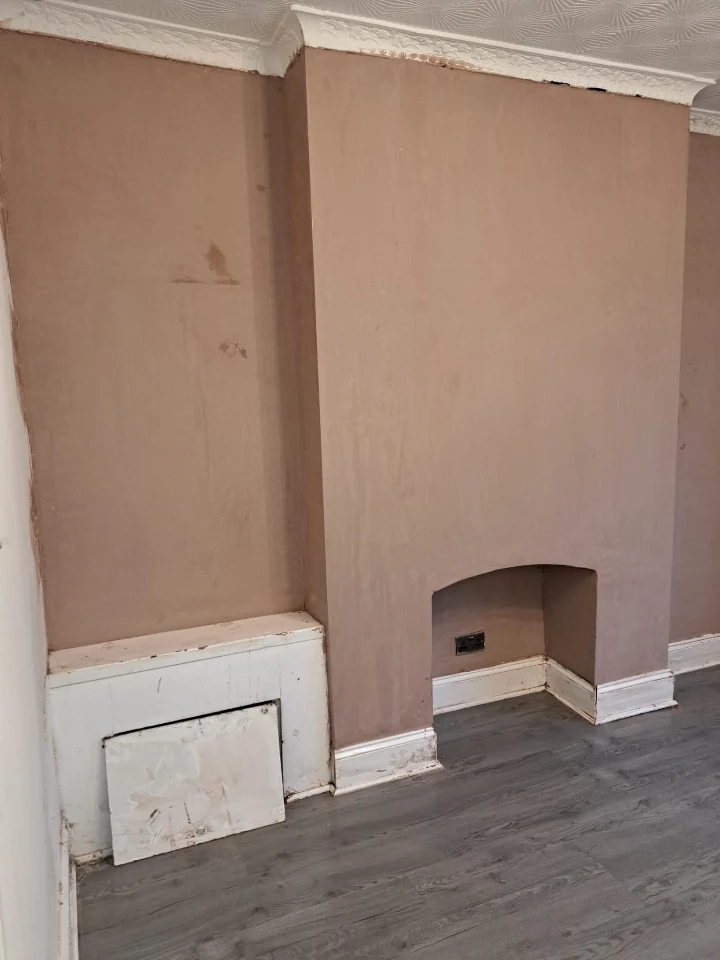 Replastered chimney breast after damp treatment in Newcastle