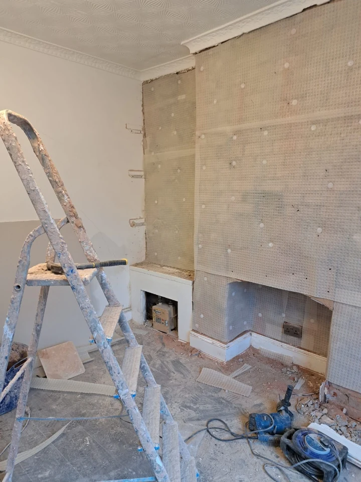 Cavity-drain membrane fitted along the base of a chimney breast in a Newcastle basement
